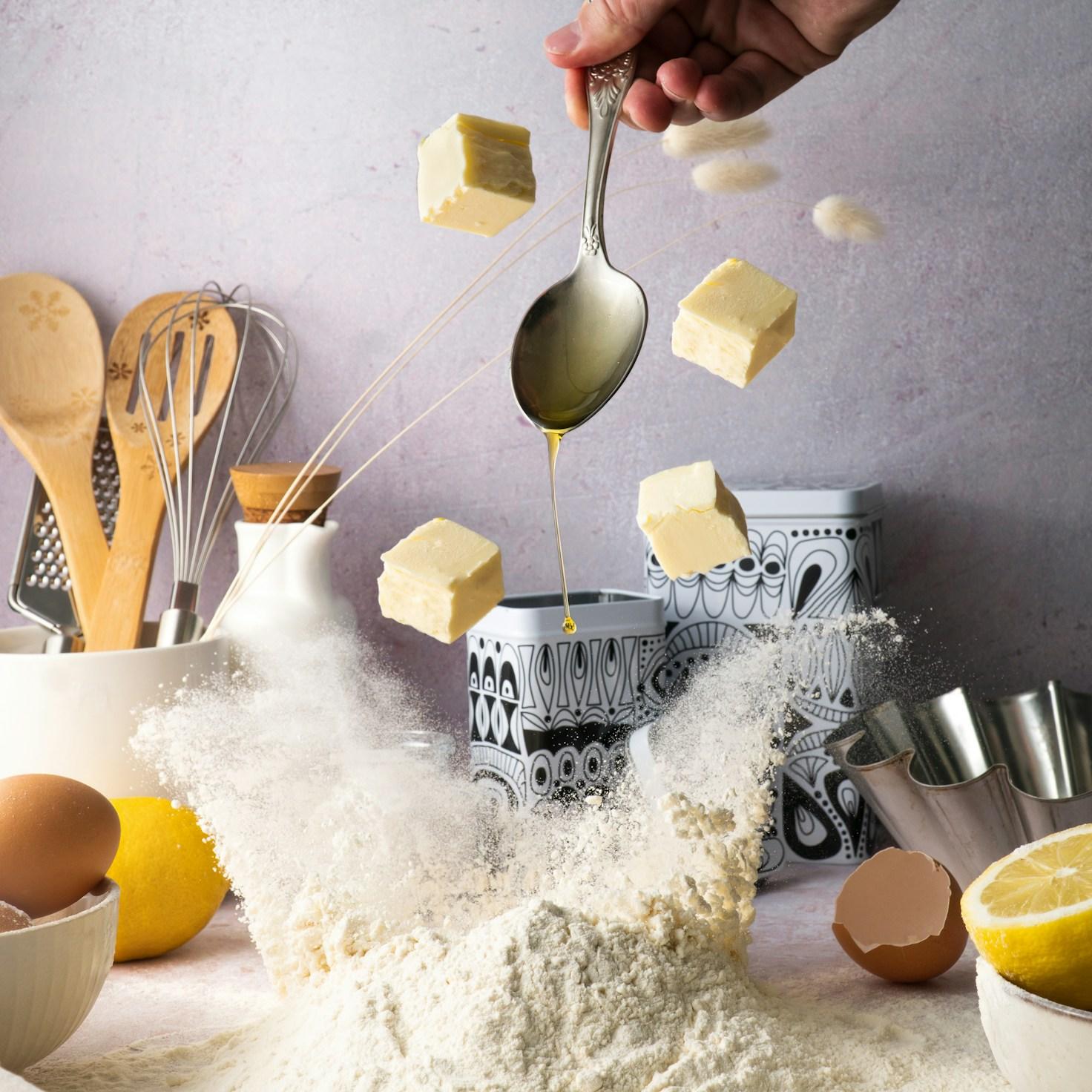 Community members collaborating in a modern kitchen space, exchanging recipes and techniques